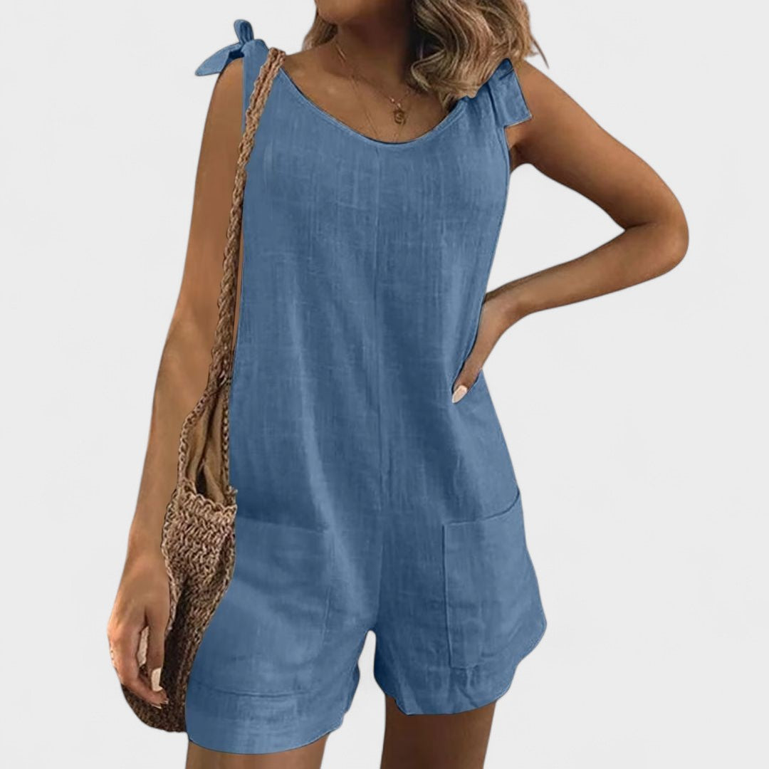 Yolanda - Mono con bolsillos en los hombros y lazo